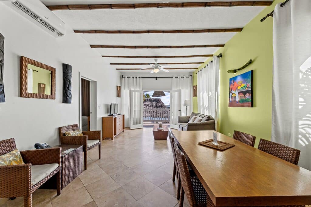 The kitchen and living room area inside of the 2 bedroom beachfront unit at Umaya Resort