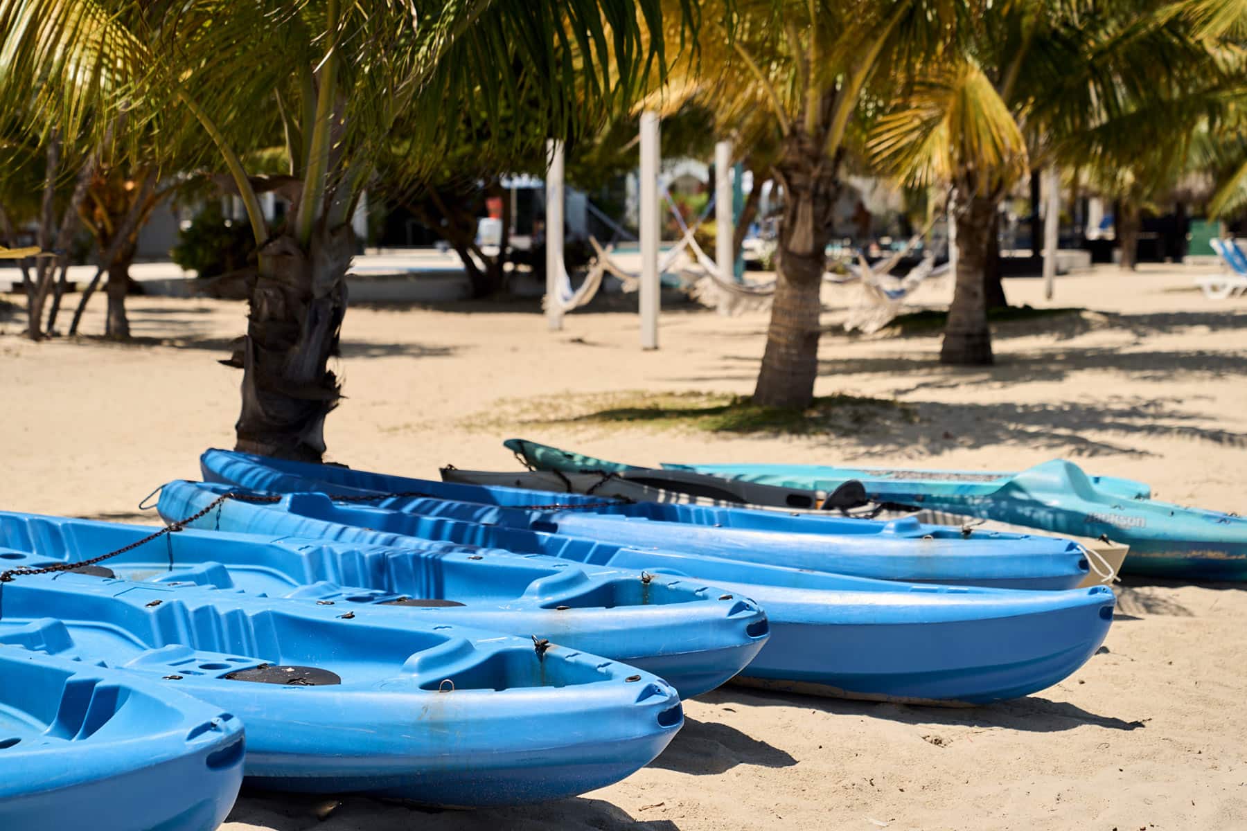 Blue canoes on the beach at Umaya Resort