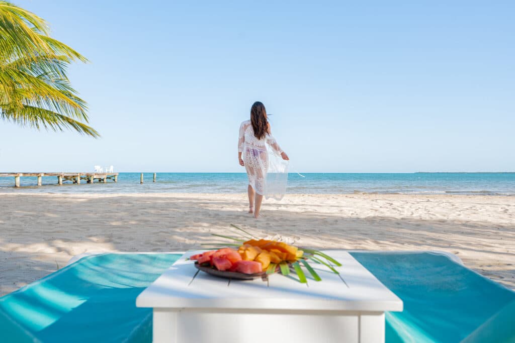 A woman walking on the beach side at Umaya Resort
