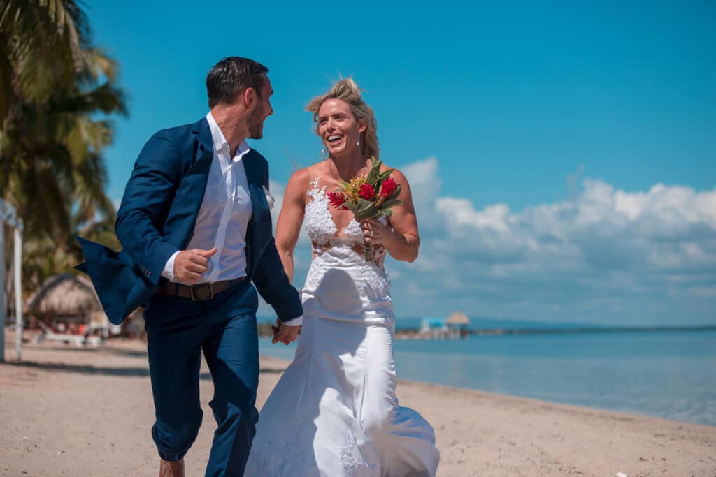 A married couple walking on the beach at Umaya Resort