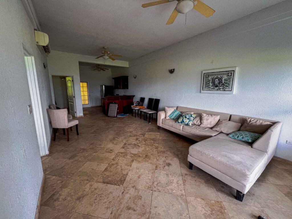 The living room and kitchen area of a ground unit at Umaya Resort & Adventures