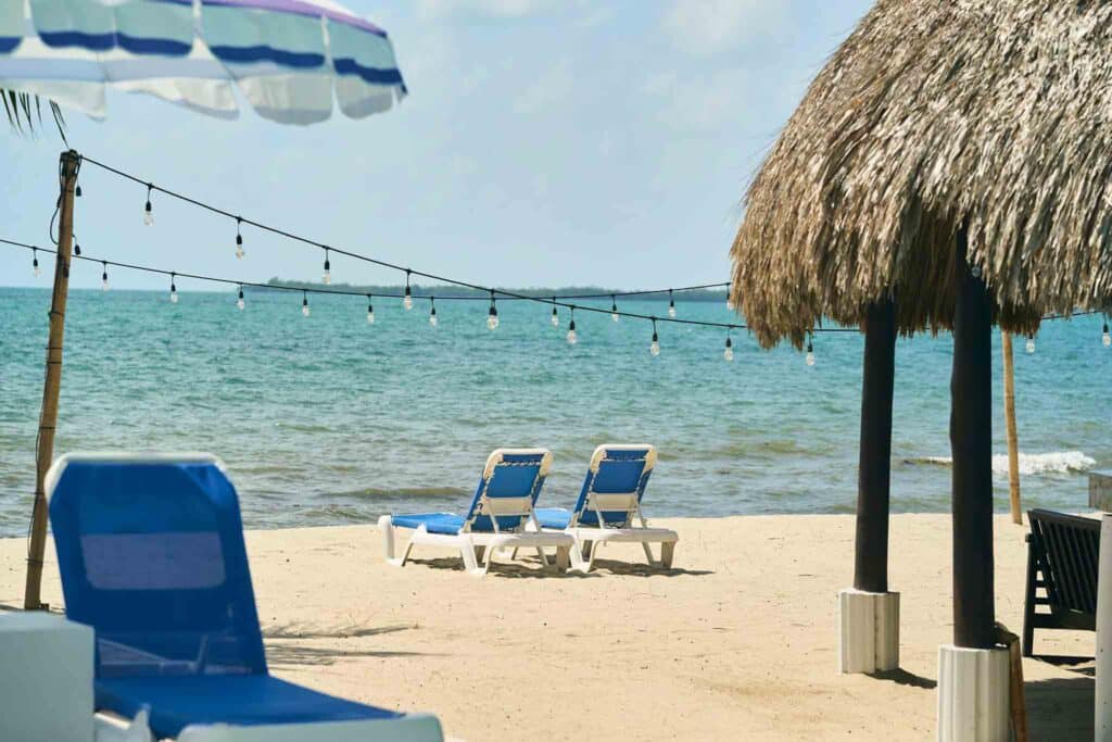 The blue beachside lounge chairs at Umaya Resort