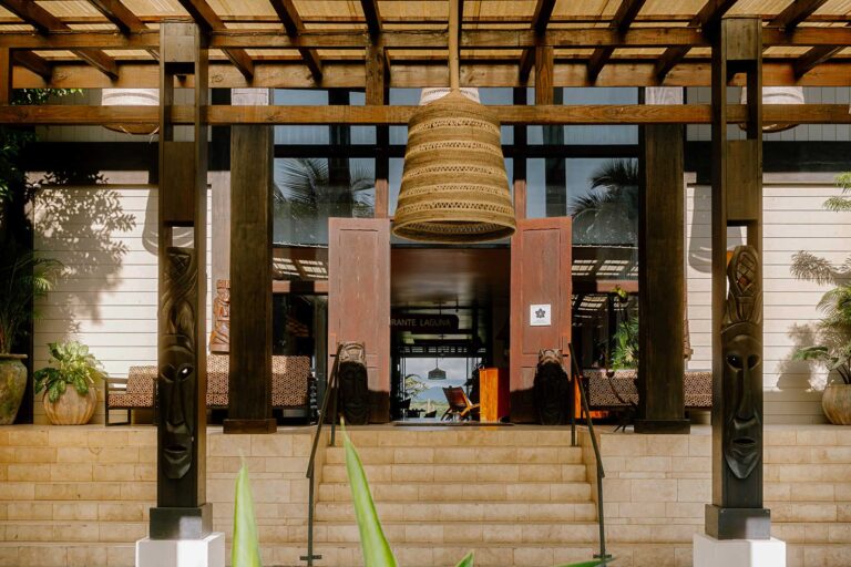 Impressive grand lobby entrance featuring an elegant sweeping staircase and dramatic double doors at Umaya Resort, Maya Beach, Placencia Peninsula, Belize